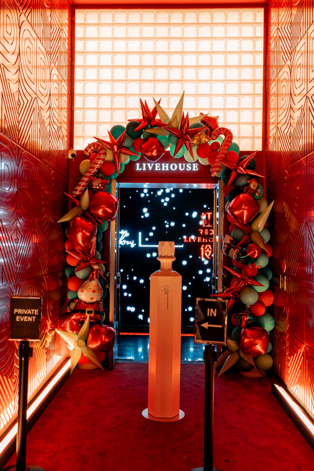 The floral LIVEHOUSE entrance arch